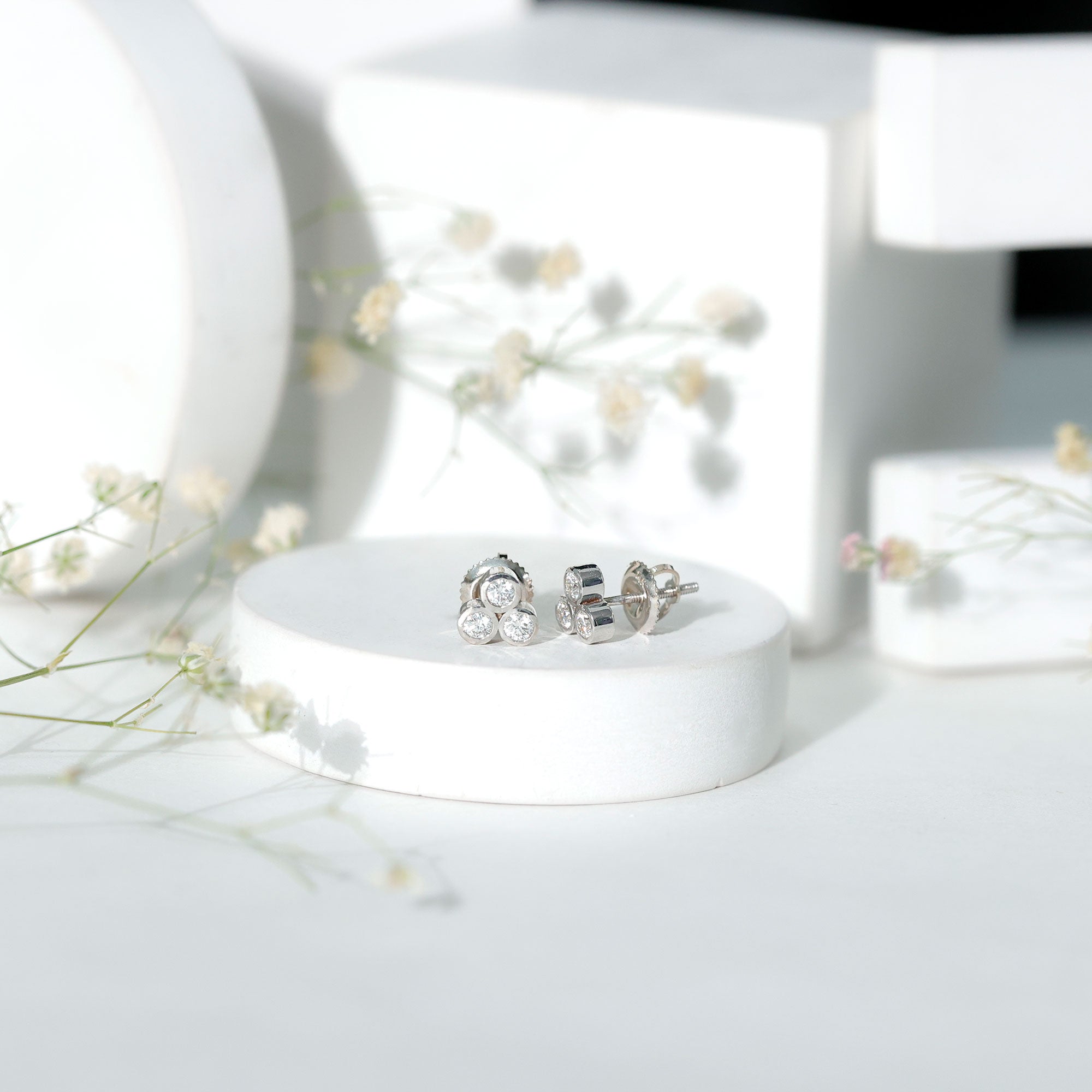 Bezel Set Round Cut Moissanite Three Stone Stud Earrings