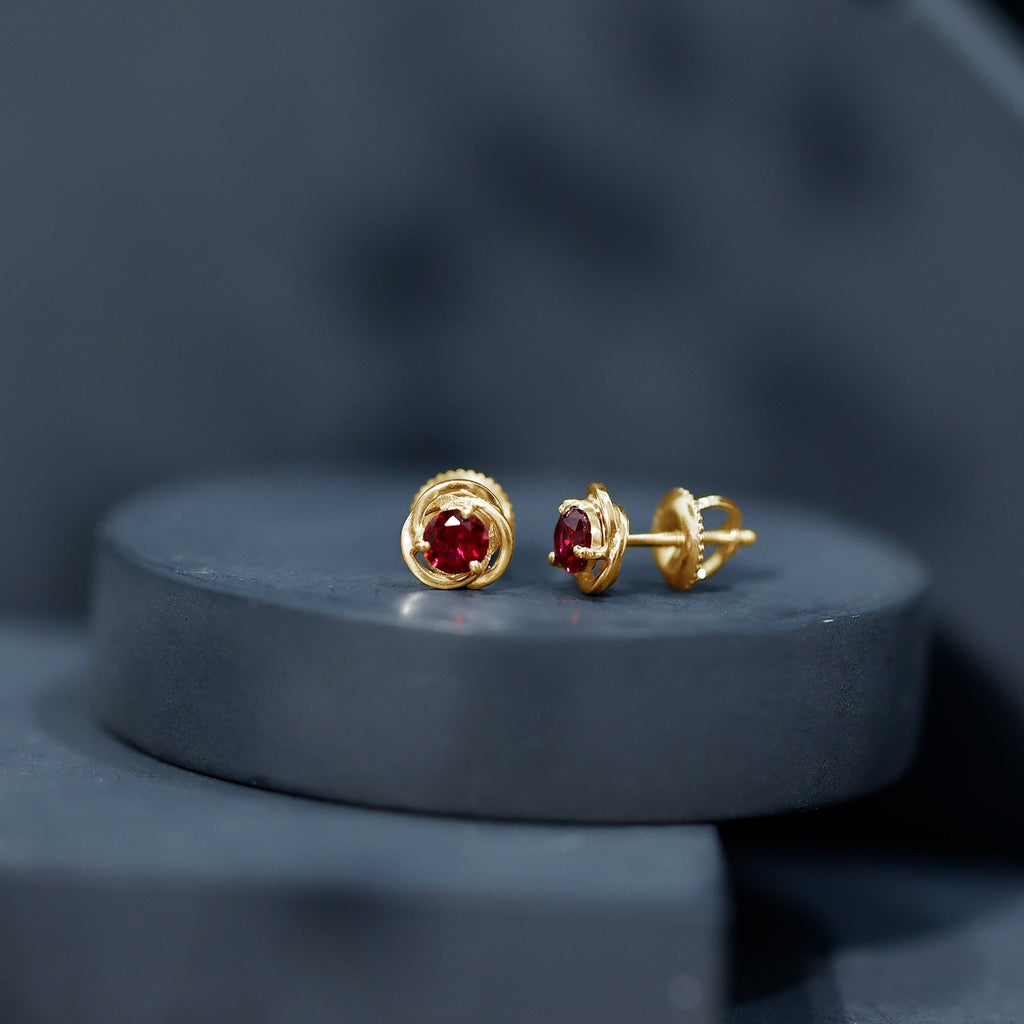Solitaire Created Ruby Swirl Stud Earrings in 3 Prong Setting