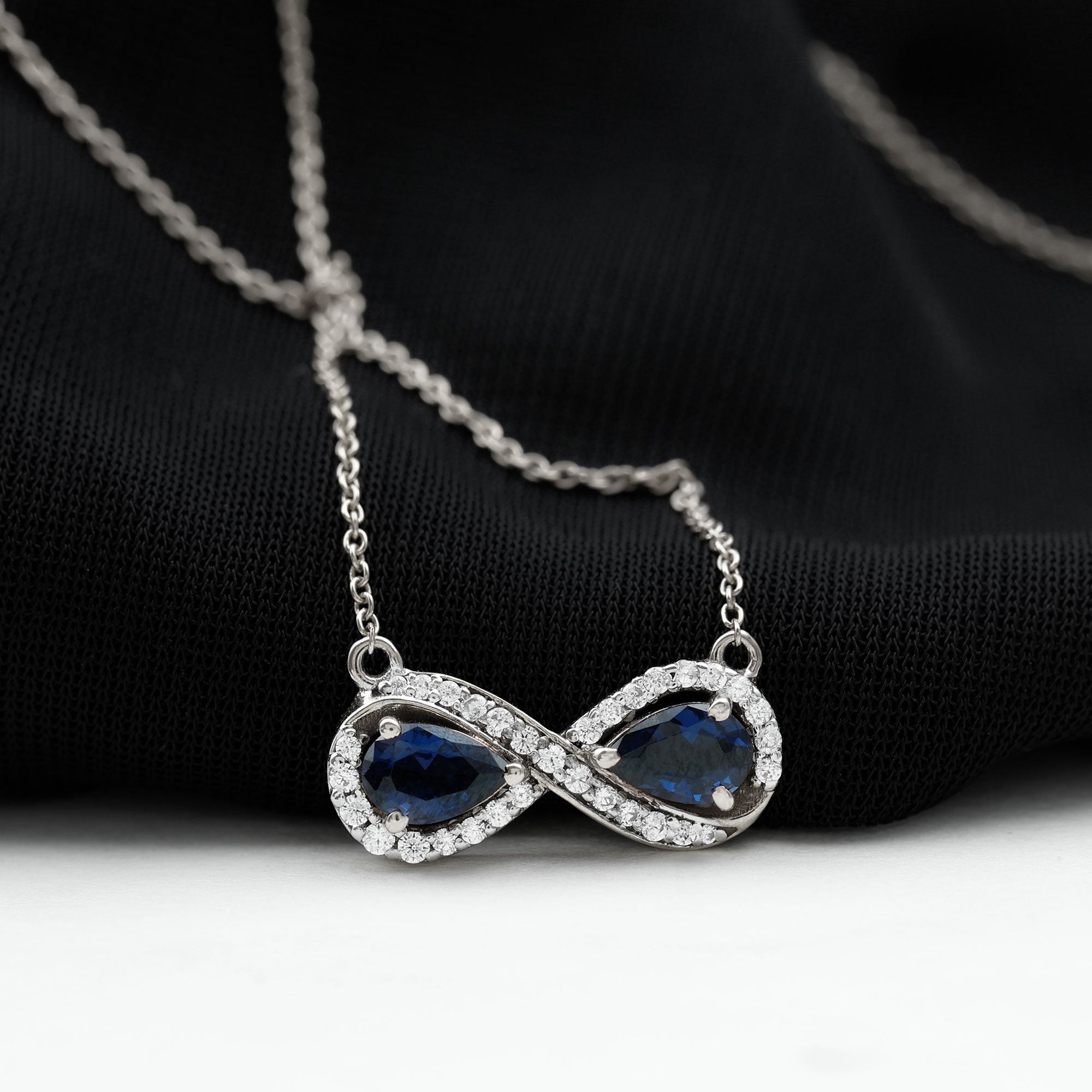 Lab Grown Blue Sapphire Infinity Necklace With Diamond Accent