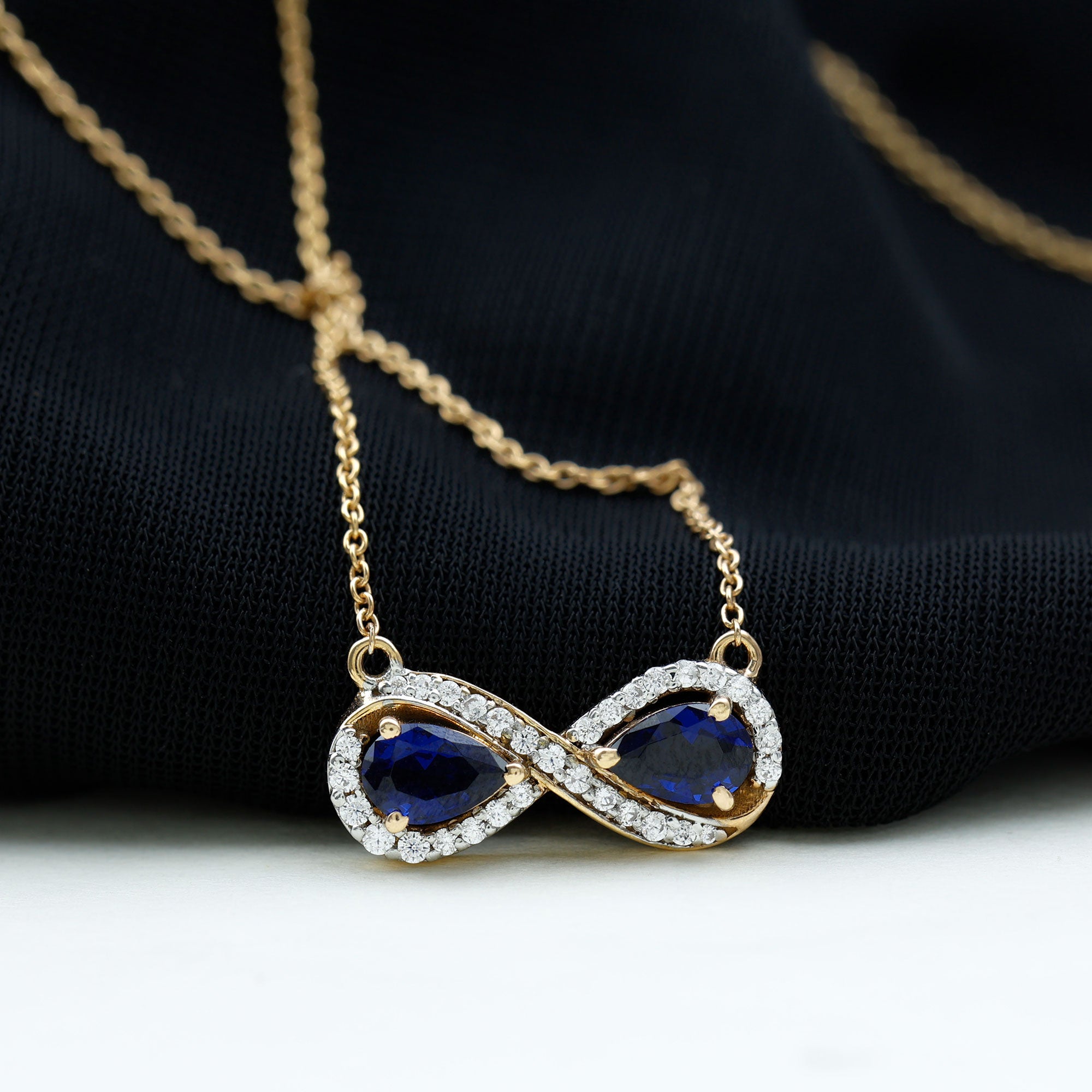 Lab Grown Blue Sapphire Infinity Necklace With Diamond Accent