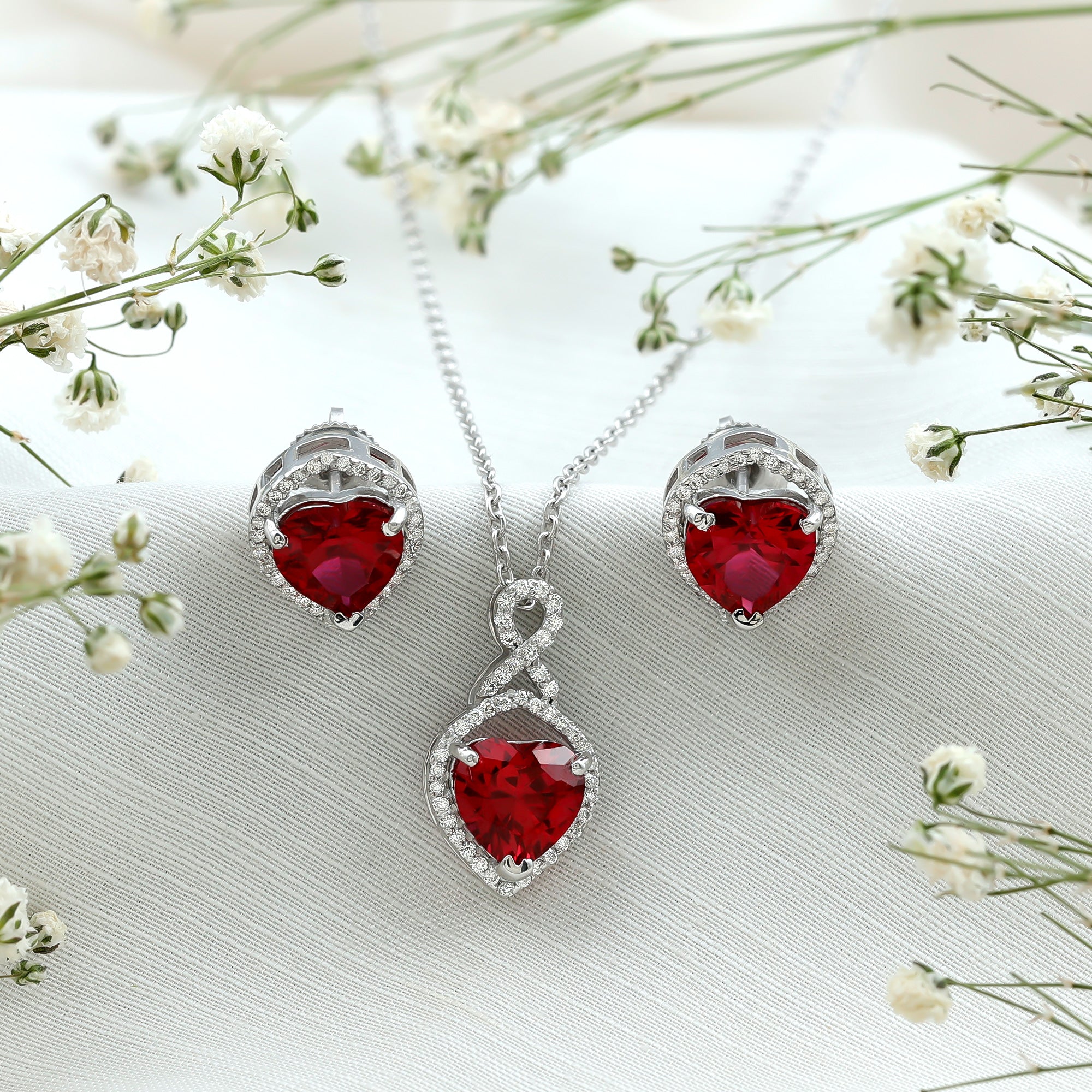 Heart Shape Created Ruby and Moissanite Infinity Pendant Earrings Set