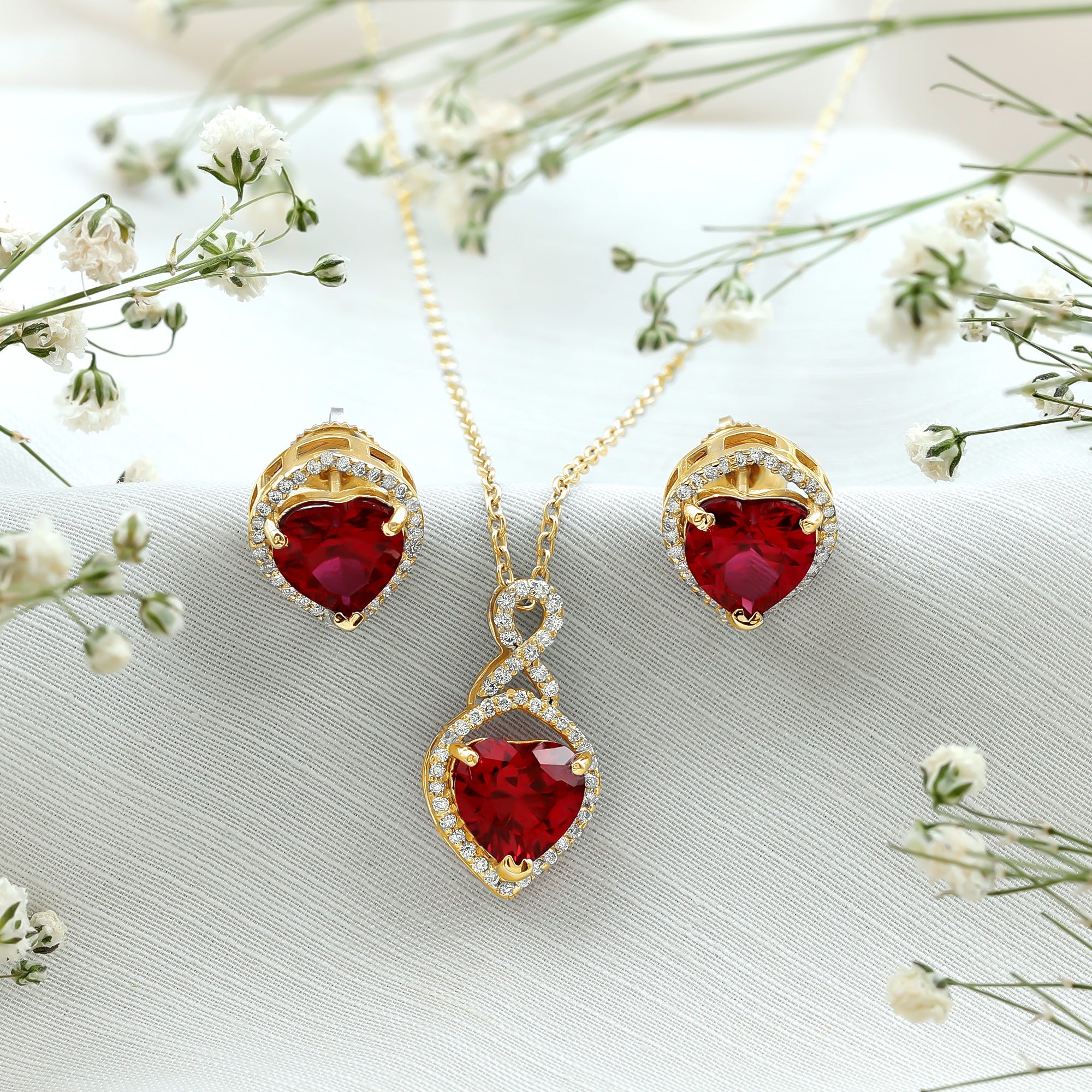 Heart Shape Created Ruby and Moissanite Infinity Pendant Earrings Set