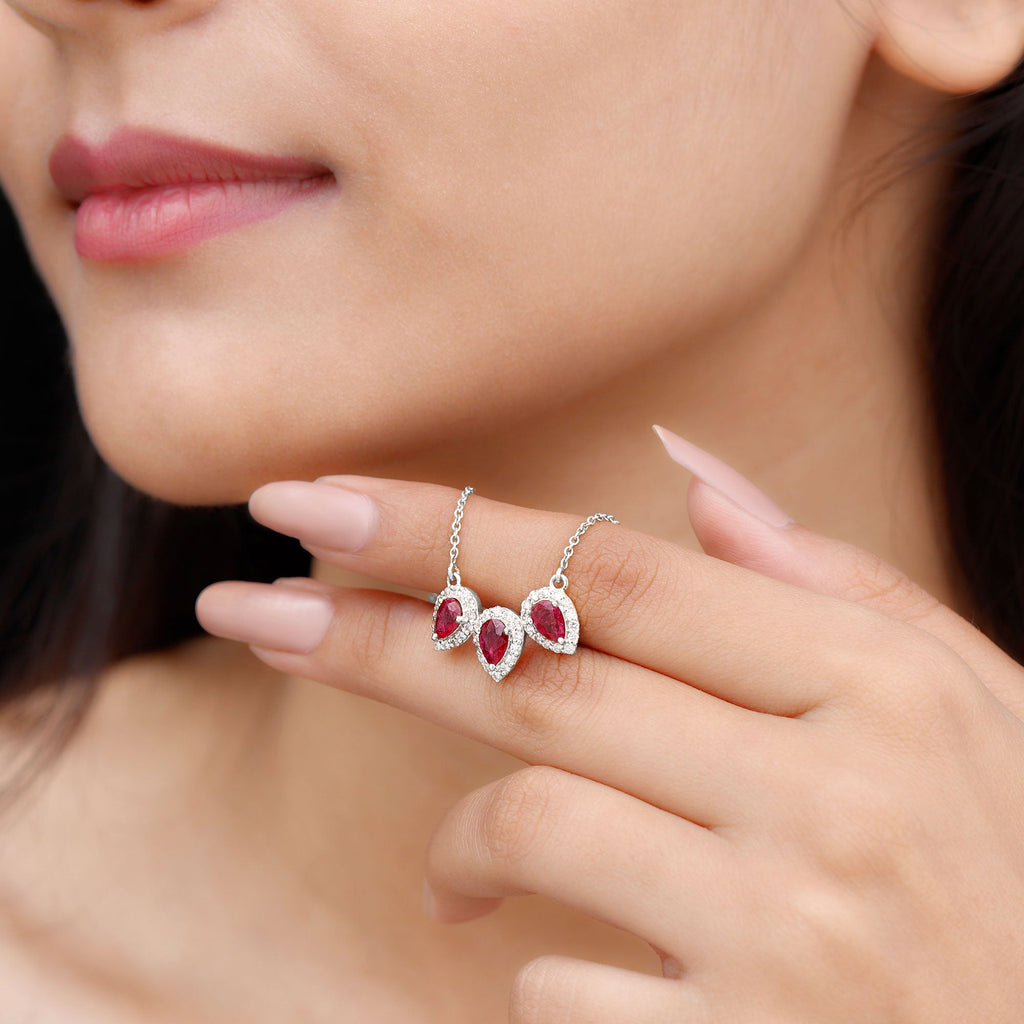 Pear Cut Lab Created Ruby Three Stone Necklace with Moissanite Halo
