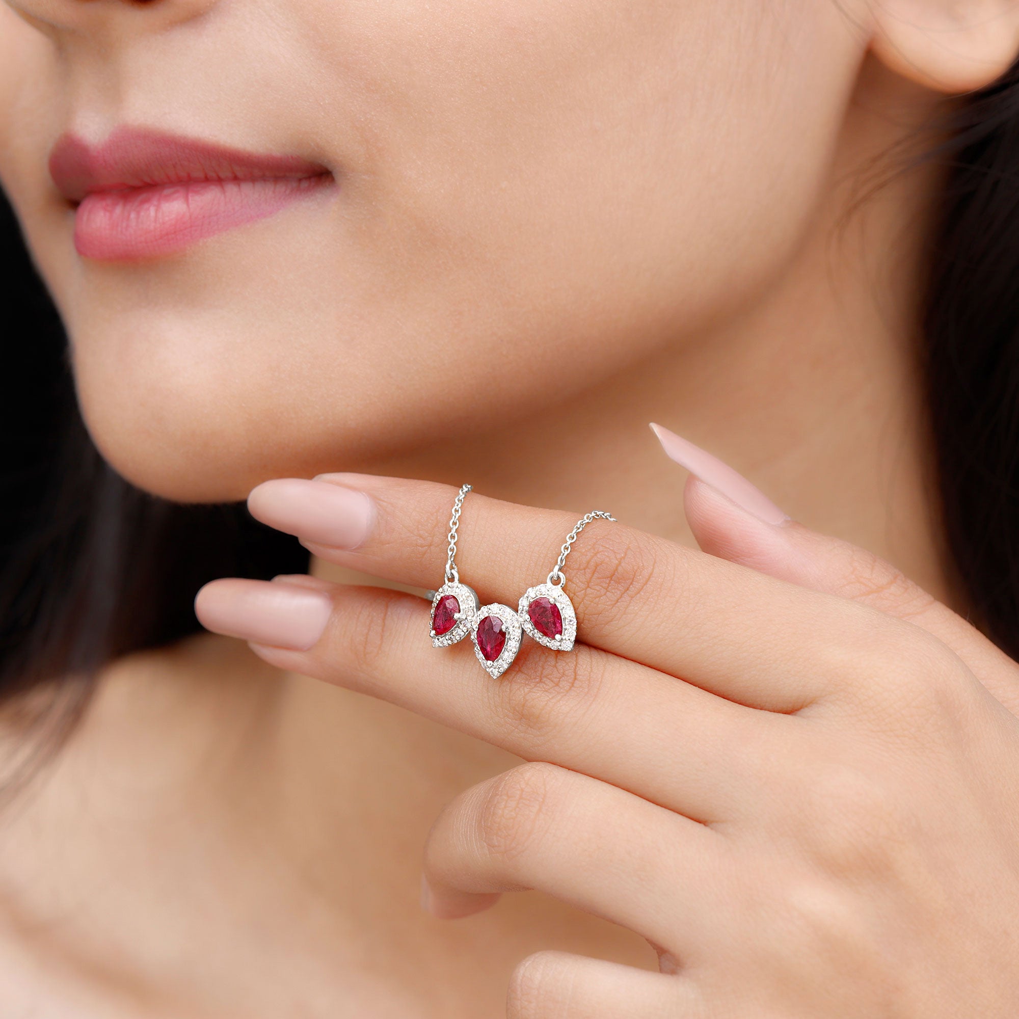 Pear Cut Lab Created Ruby Three Stone Necklace with Moissanite Halo