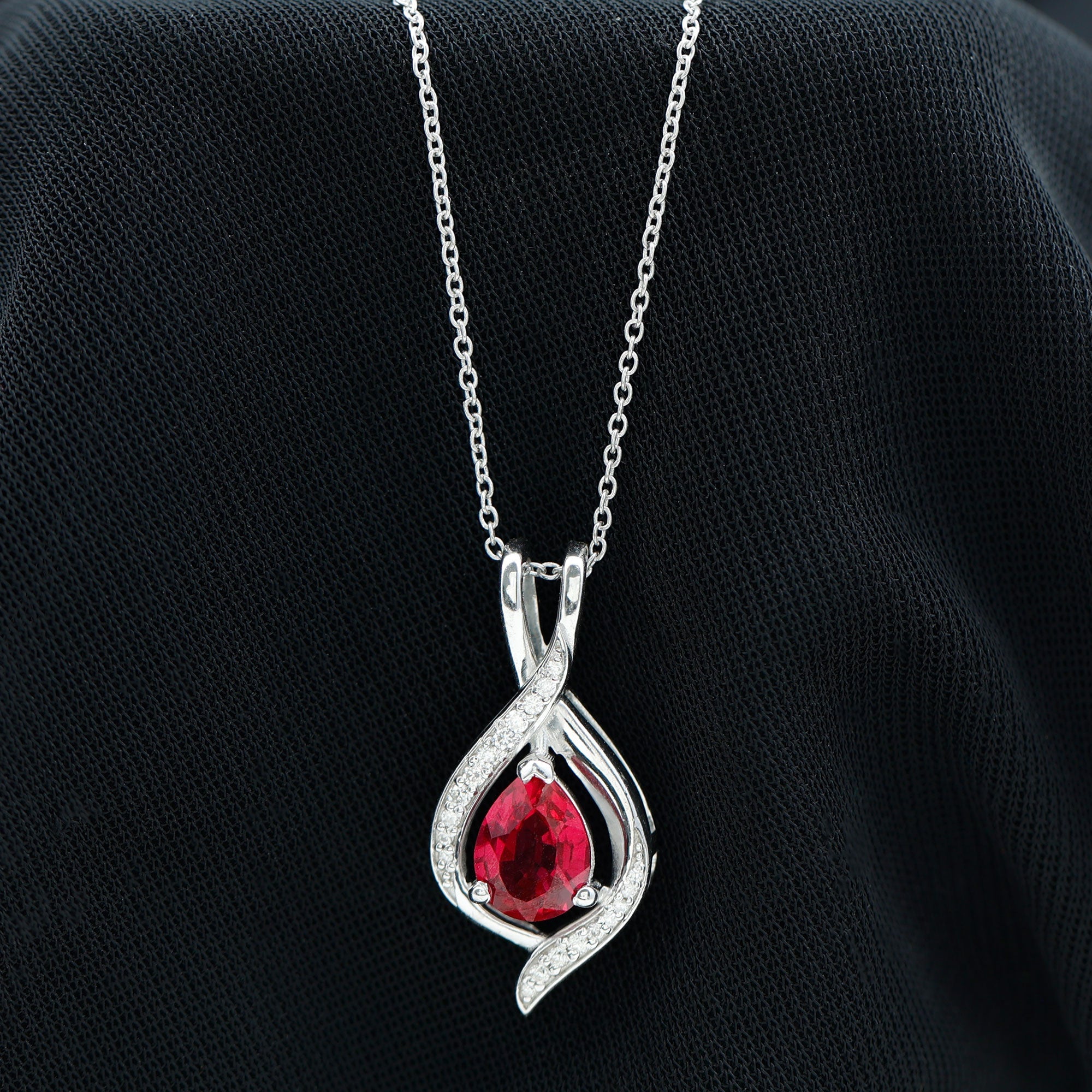 Pear Cut Created Ruby Teardrop Pendant with Moissanite Accent