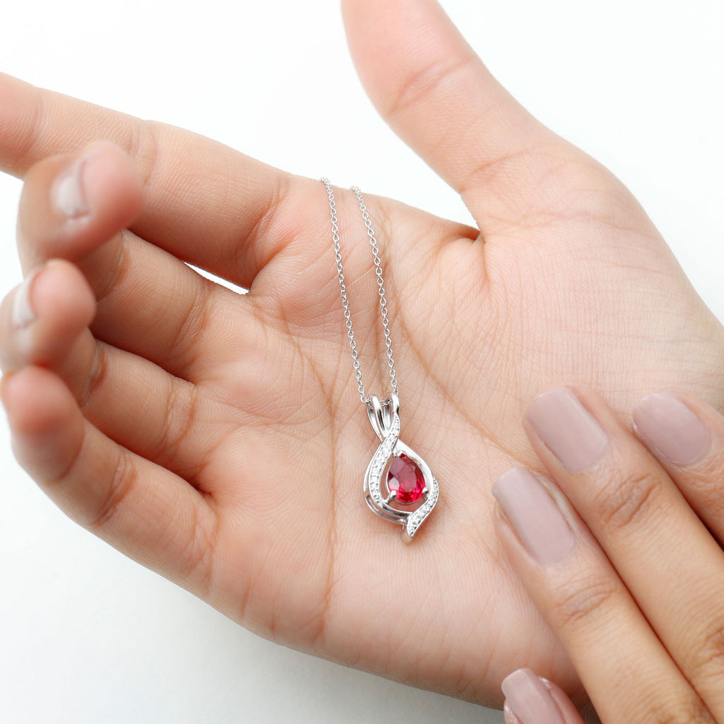 Pear Cut Created Ruby Teardrop Pendant with Moissanite Accent