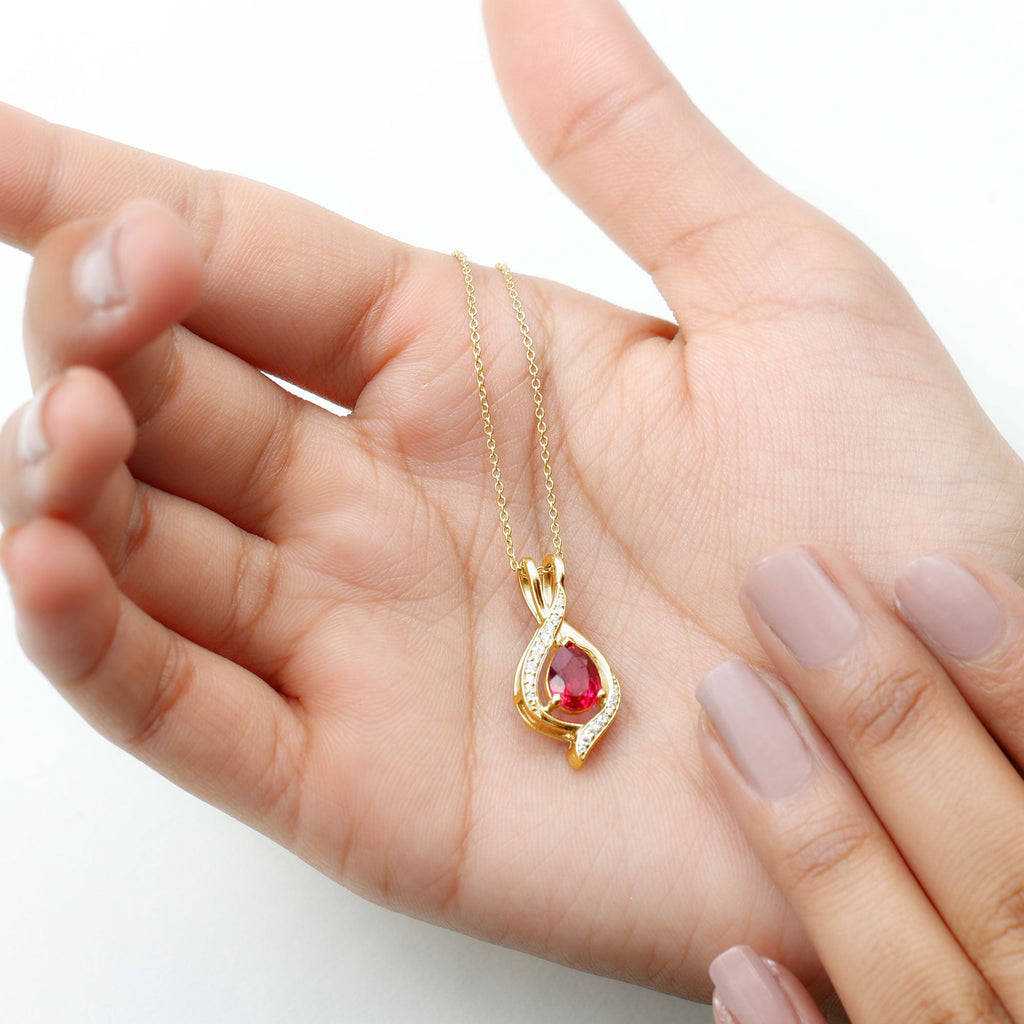 Pear Cut Created Ruby Teardrop Pendant with Moissanite Accent