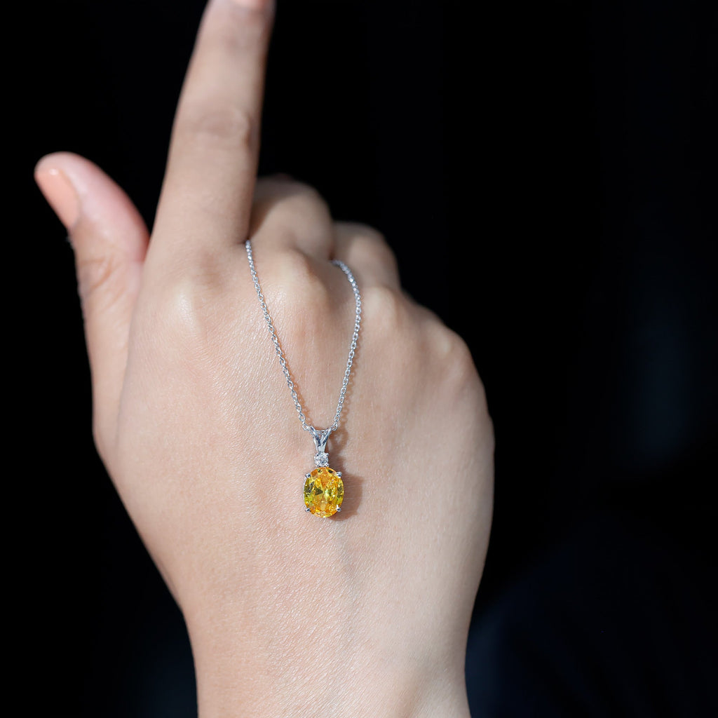 Oval Created Yellow Sapphire and Moissanite Solitaire Pendant