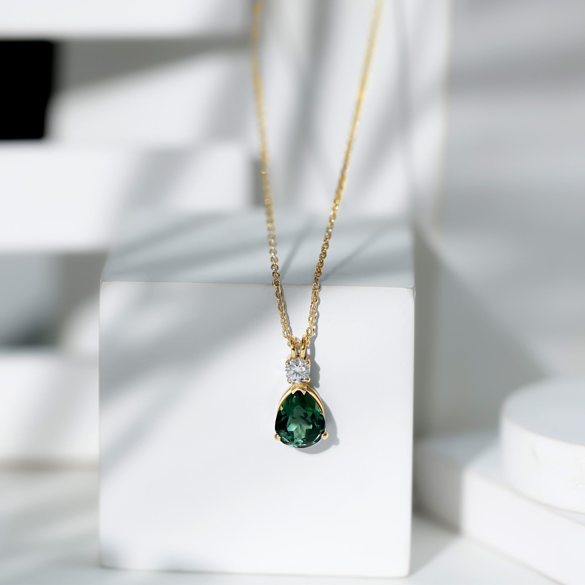 Pear Cut Created Green Sapphire Drop Pendant with Moissanite
