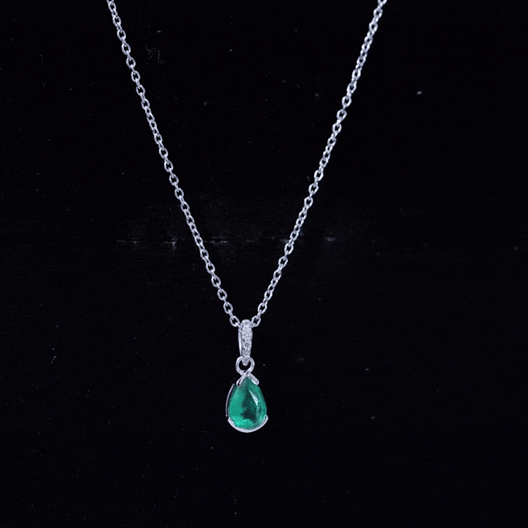 3/4 CT Pear Cut Emerald Solitaire Pendant in Half Bezel Setting with Diamond Accent Bail