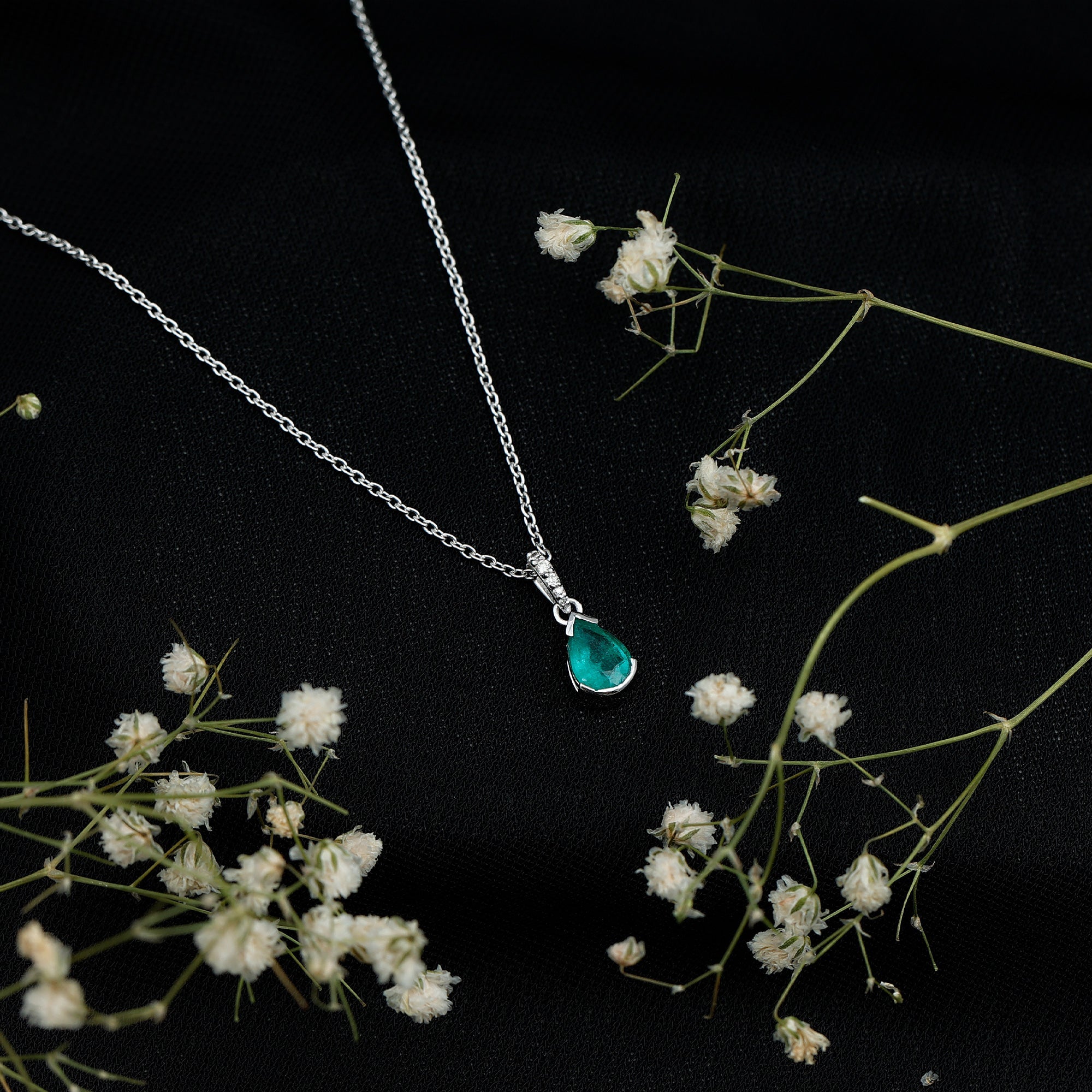3/4 CT Pear Cut Emerald Solitaire Pendant in Half Bezel Setting with Diamond Accent Bail