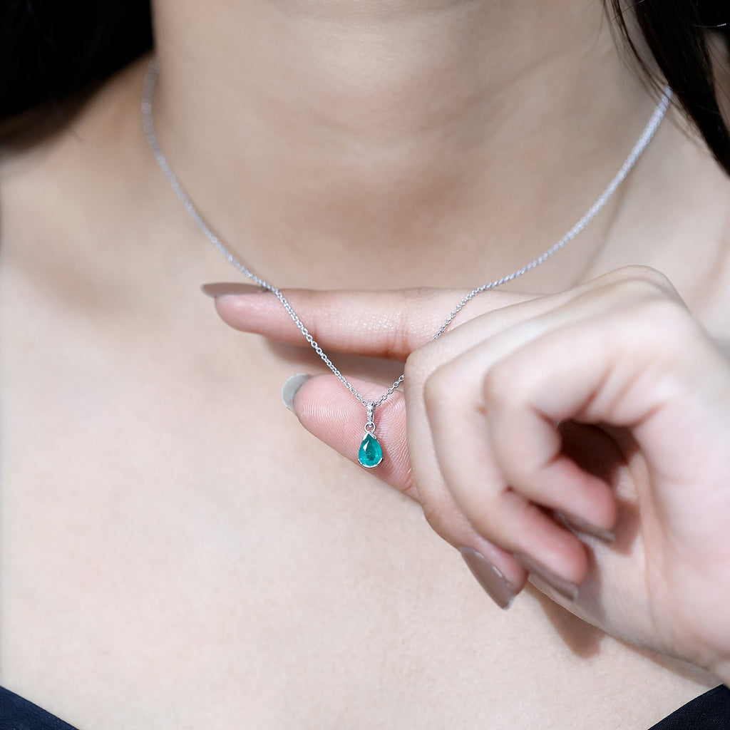 3/4 CT Pear Cut Emerald Solitaire Pendant in Half Bezel Setting with Diamond Accent Bail