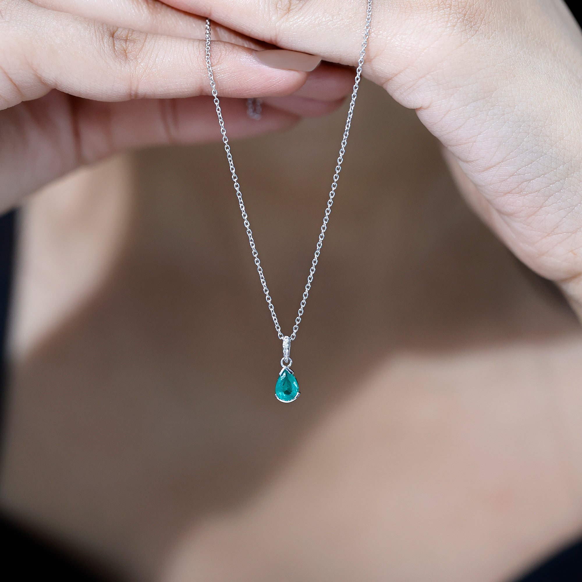 3/4 CT Pear Cut Emerald Solitaire Pendant in Half Bezel Setting with Diamond Accent Bail