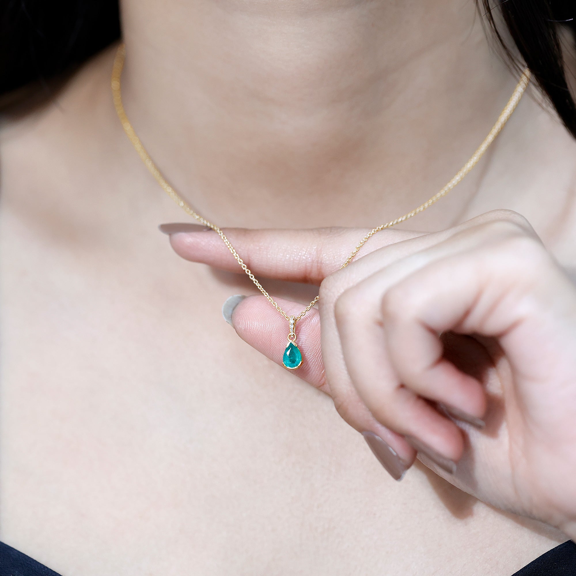 3/4 CT Pear Cut Emerald Solitaire Pendant in Half Bezel Setting with Diamond Accent Bail
