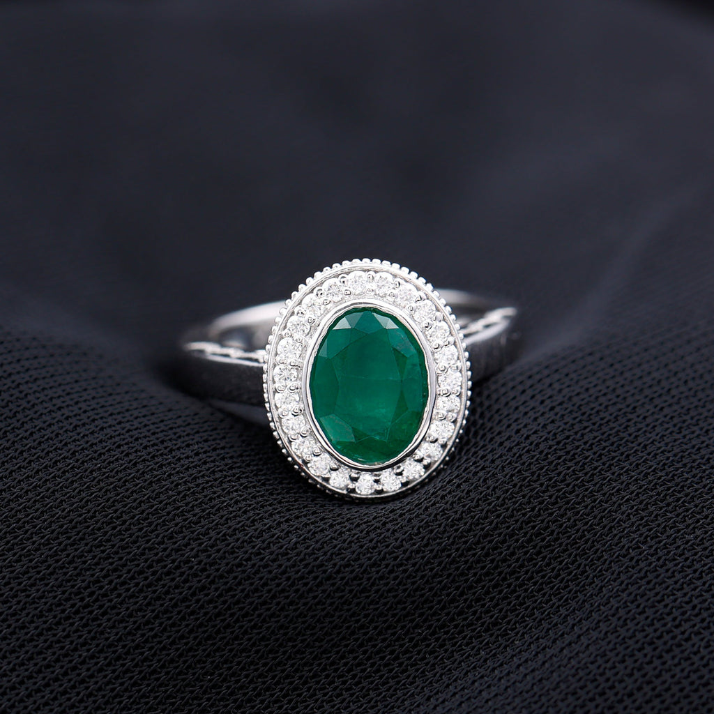 6X8 mm Oval Lab Grown Emerald Bezel Set Engagement Ring With Diamond Halo
