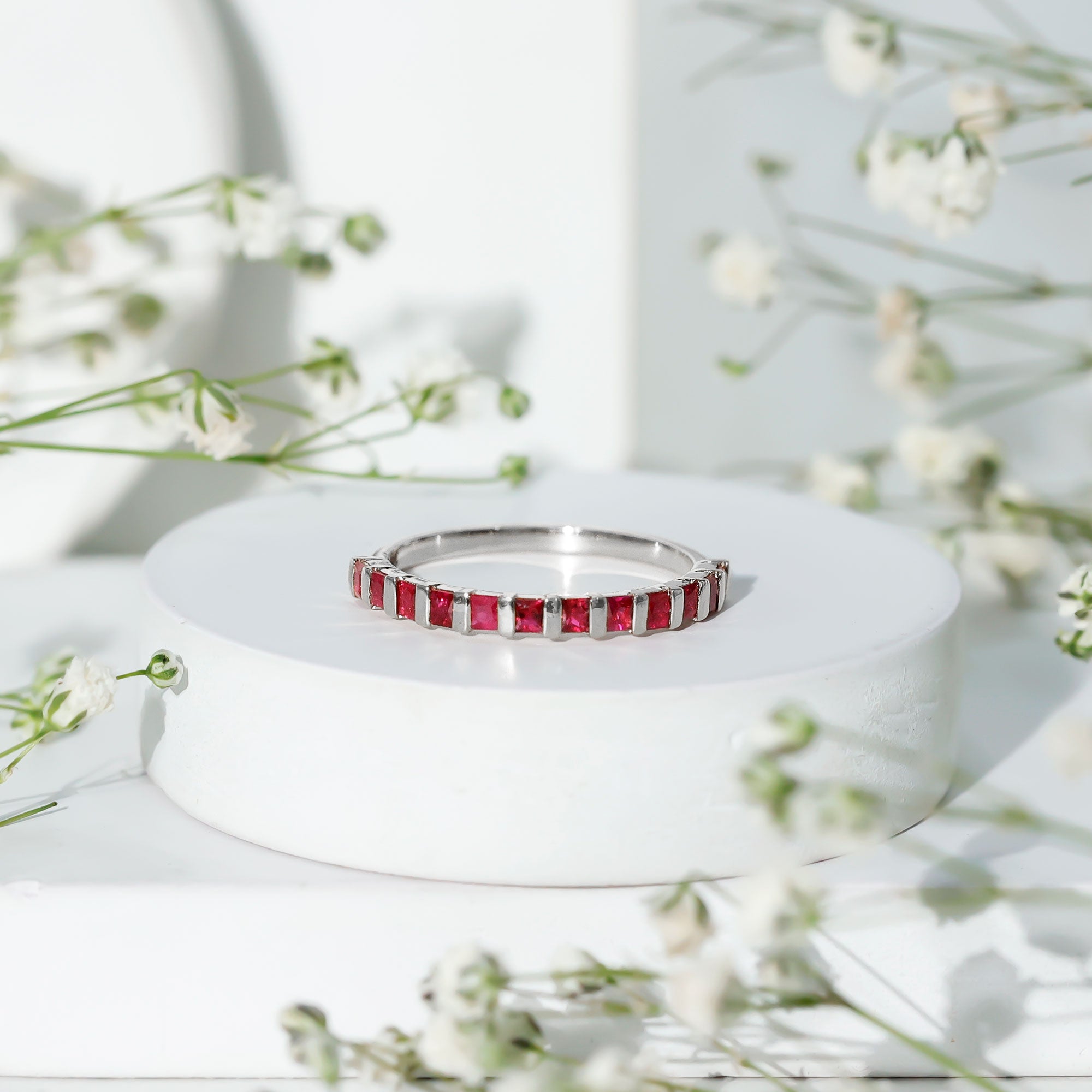 Princess Cut Ruby Semi Eternity Ring in Bar Setting