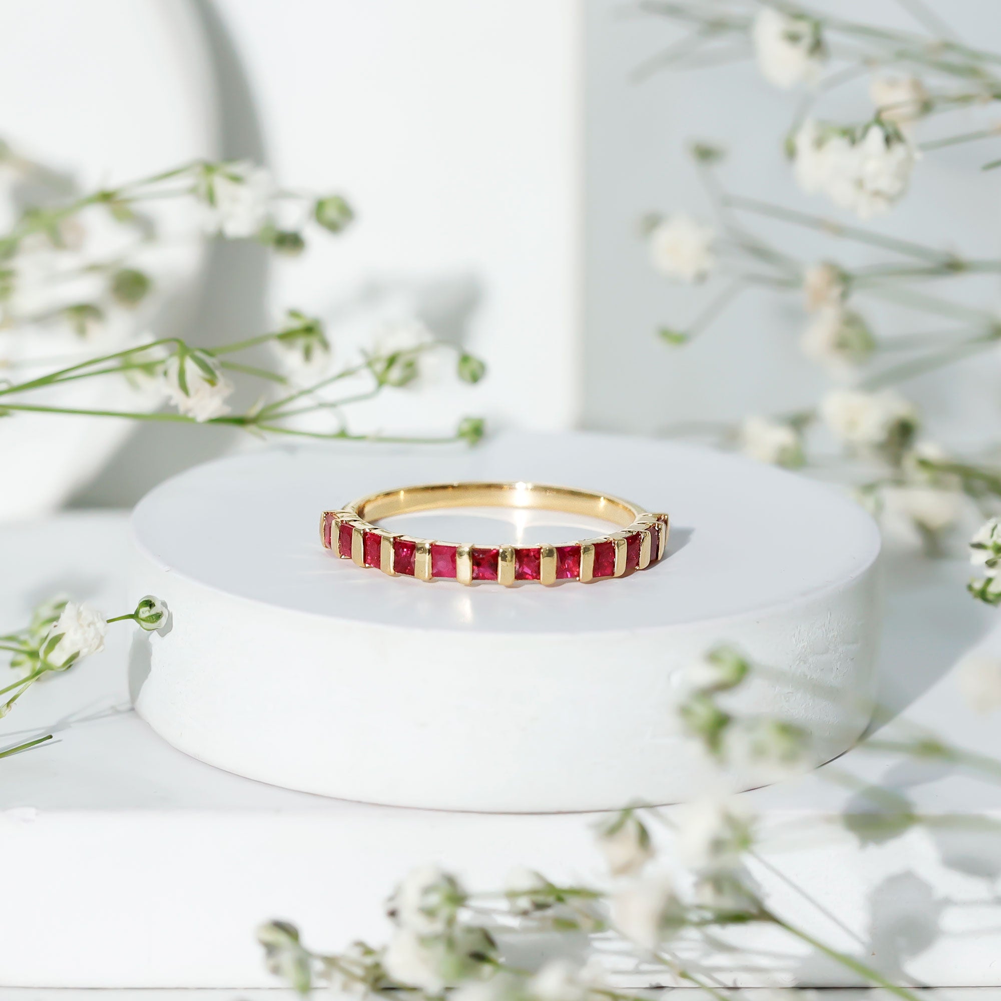 Princess Cut Ruby Semi Eternity Ring in Bar Setting
