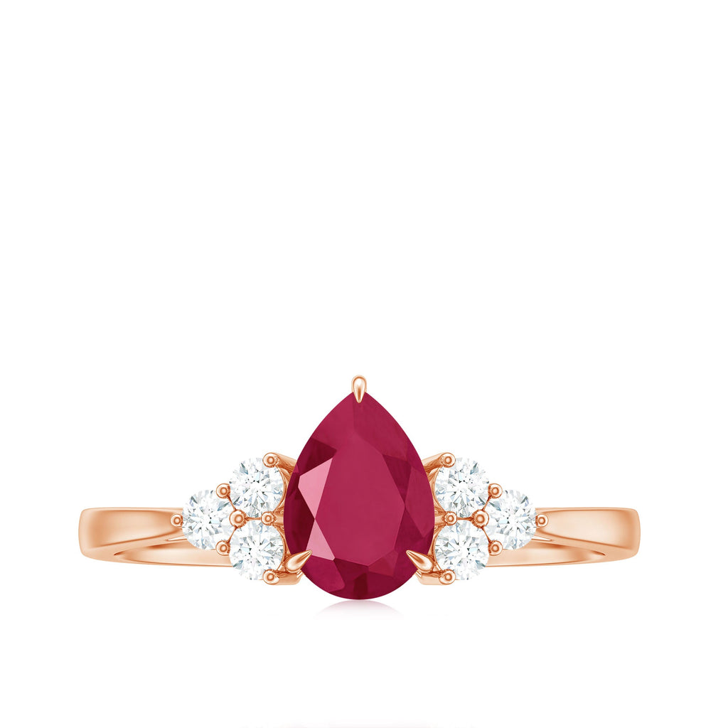 Claw Set Pear Cut Ruby Engagement Ring with Diamond Trio