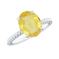 Oval Created Yellow Sapphire Solitaire Ring with Surprise Diamond