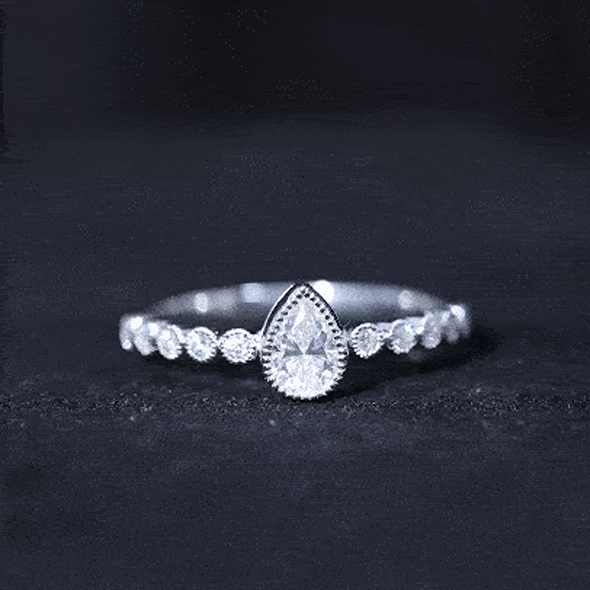 Lab Grown Diamond 5X7 MM Pear Shaped Engagement Ring With Side Stones