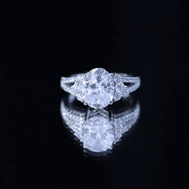 Solitaire Cubic Zirconia Oval Engagement Ring with Side Stones