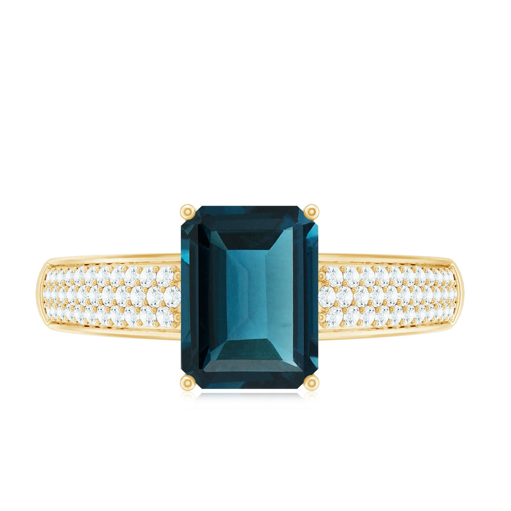 6X8mm Emerald Cut London Blue Topaz Side Stone Engagement Ring with Diamond