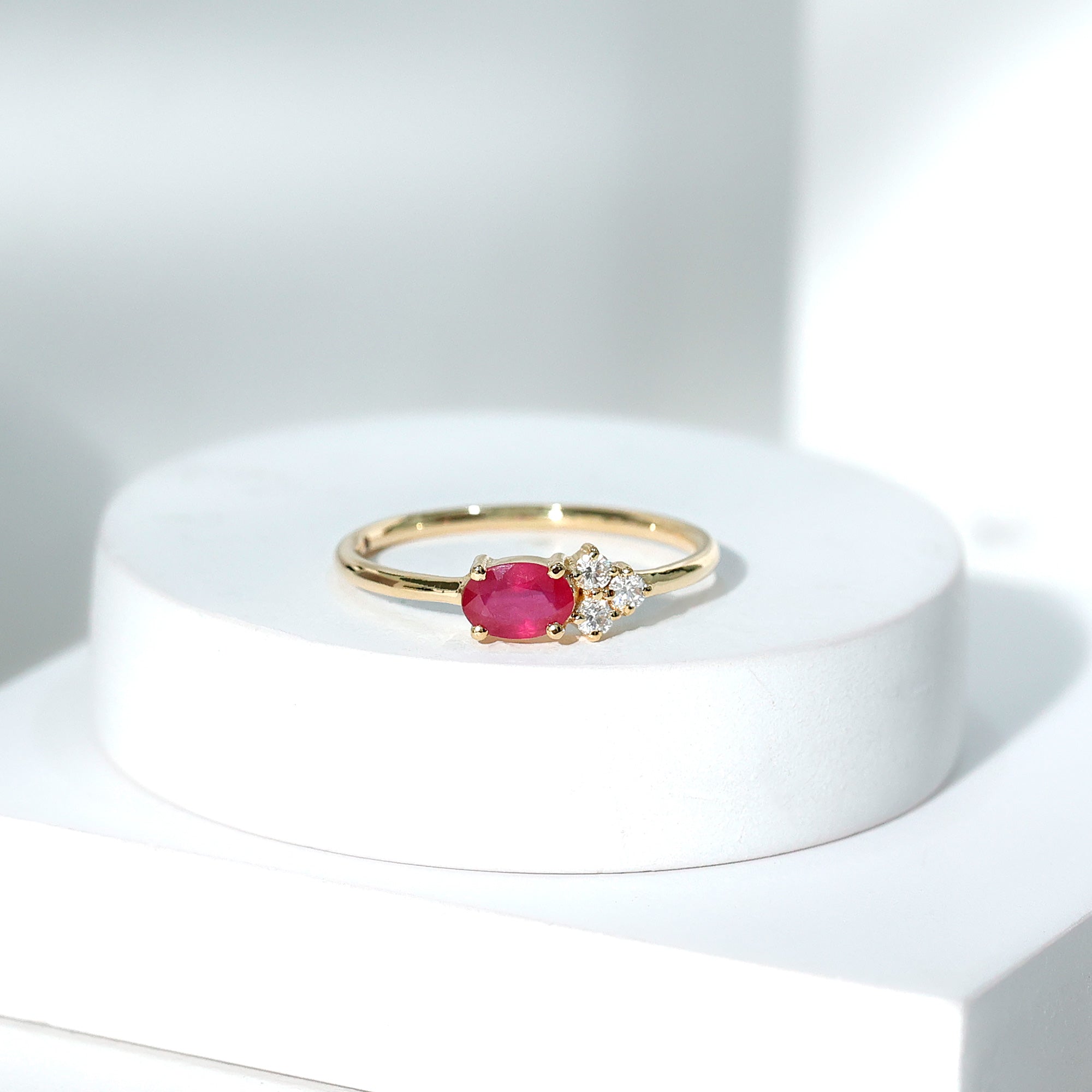Oval Cut Ruby Promise Ring with Diamond Trio