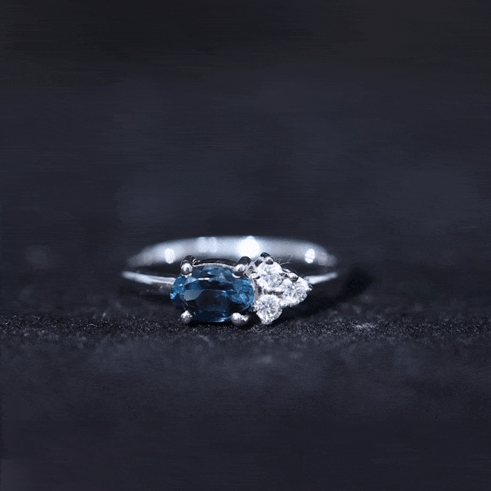 4X6mm Oval Cut London Blue Topaz East West Promise Ring with Diamond Trio