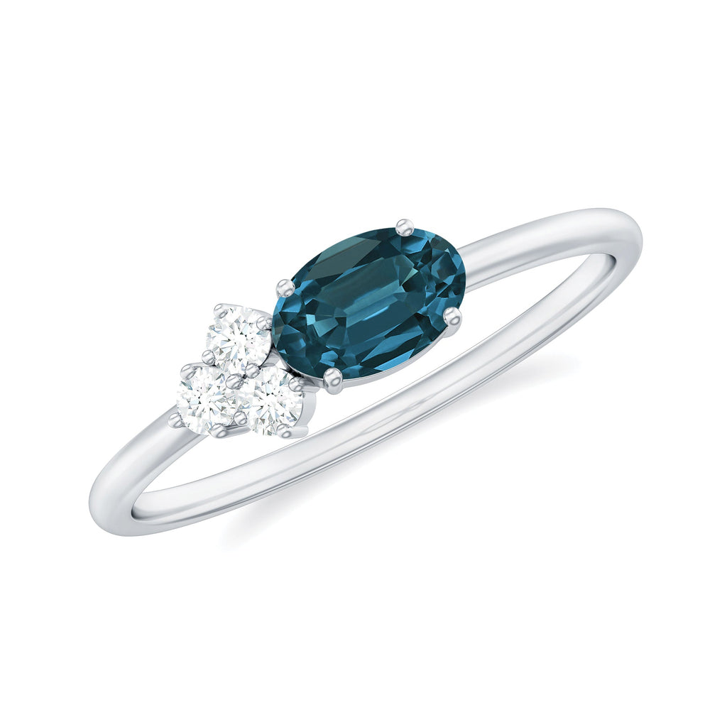 4X6mm Oval Cut London Blue Topaz East West Promise Ring with Diamond Trio