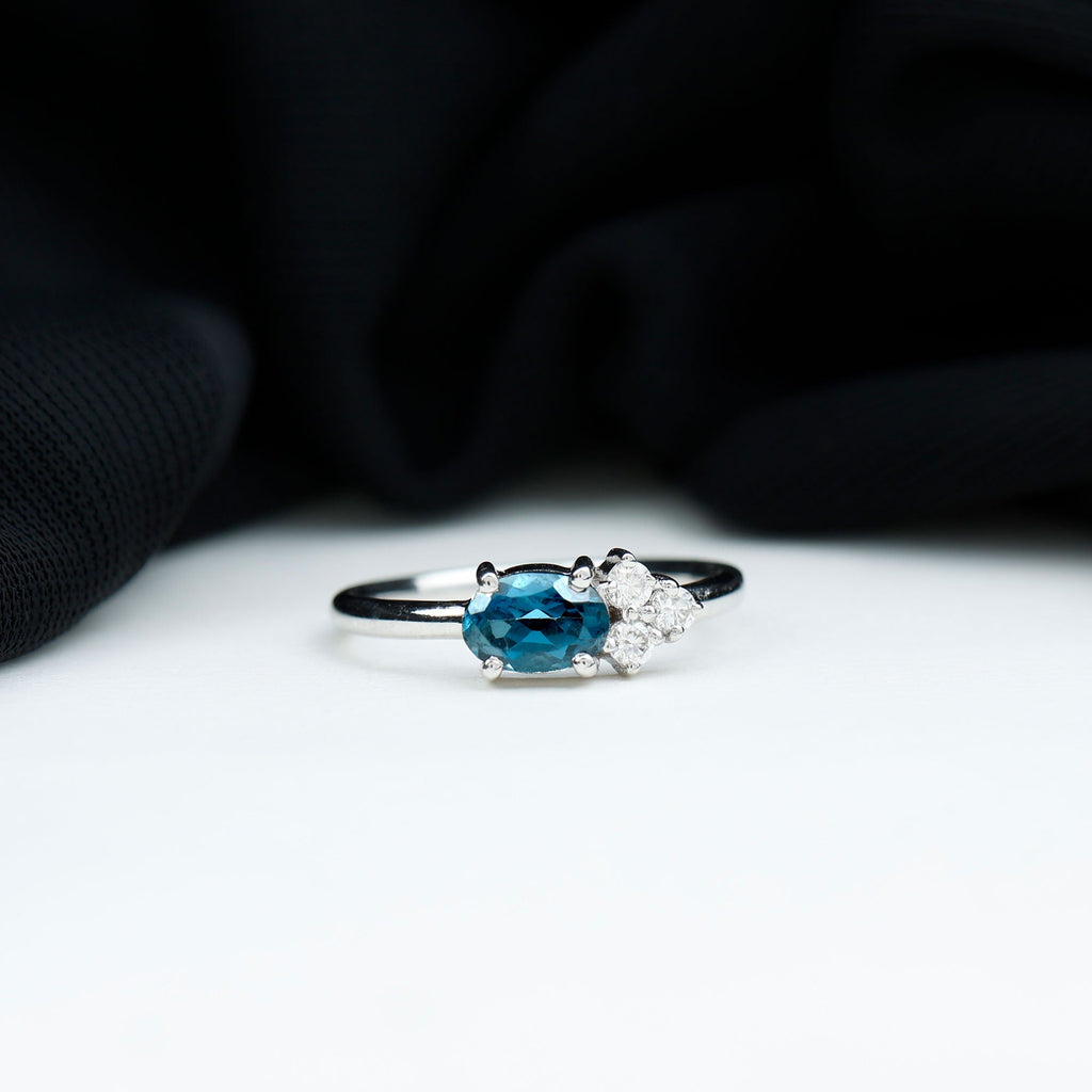 4X6mm Oval Cut London Blue Topaz East West Promise Ring with Diamond Trio