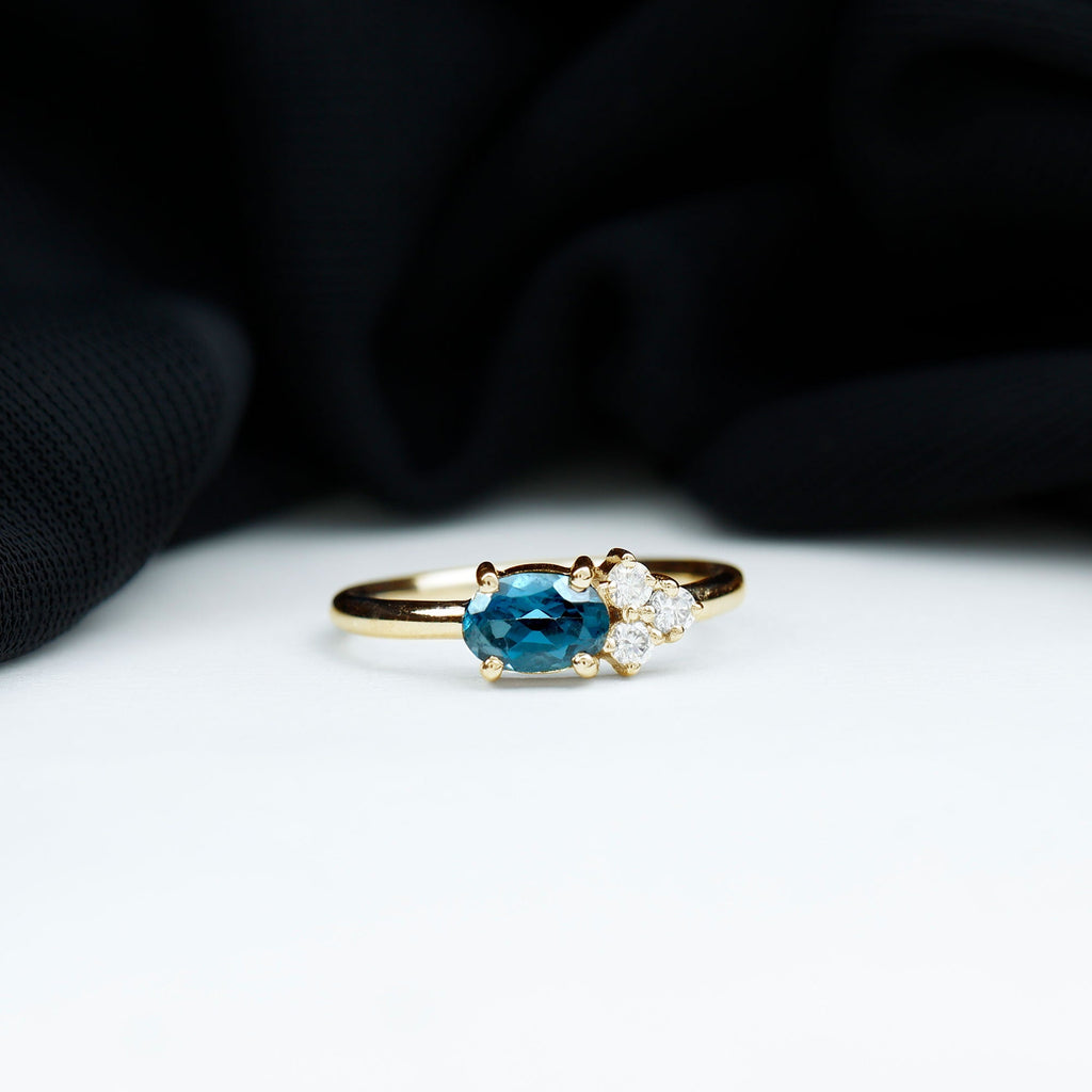 4X6mm Oval Cut London Blue Topaz East West Promise Ring with Diamond Trio