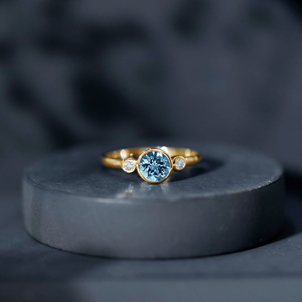Bezel Set Aquamarine Solitaire Engagement Ring with Diamond
