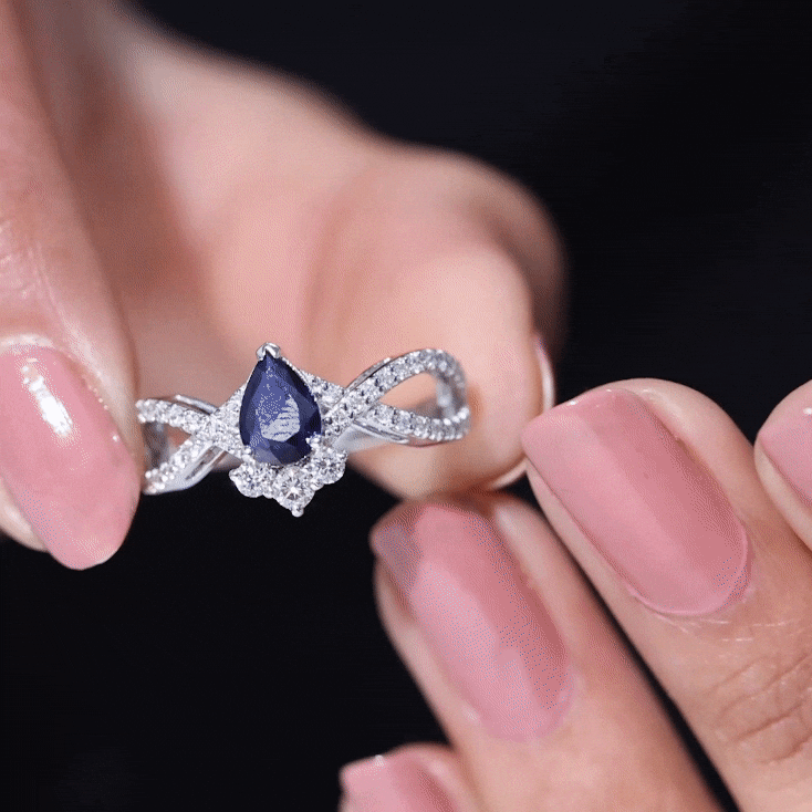 Pear Cut Blue Sapphire and Diamond Crossover Engagement Ring