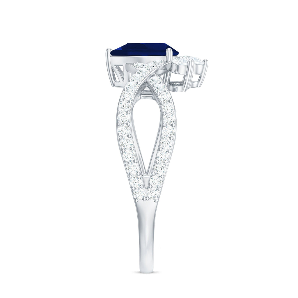 Pear Cut Blue Sapphire and Diamond Crossover Engagement Ring