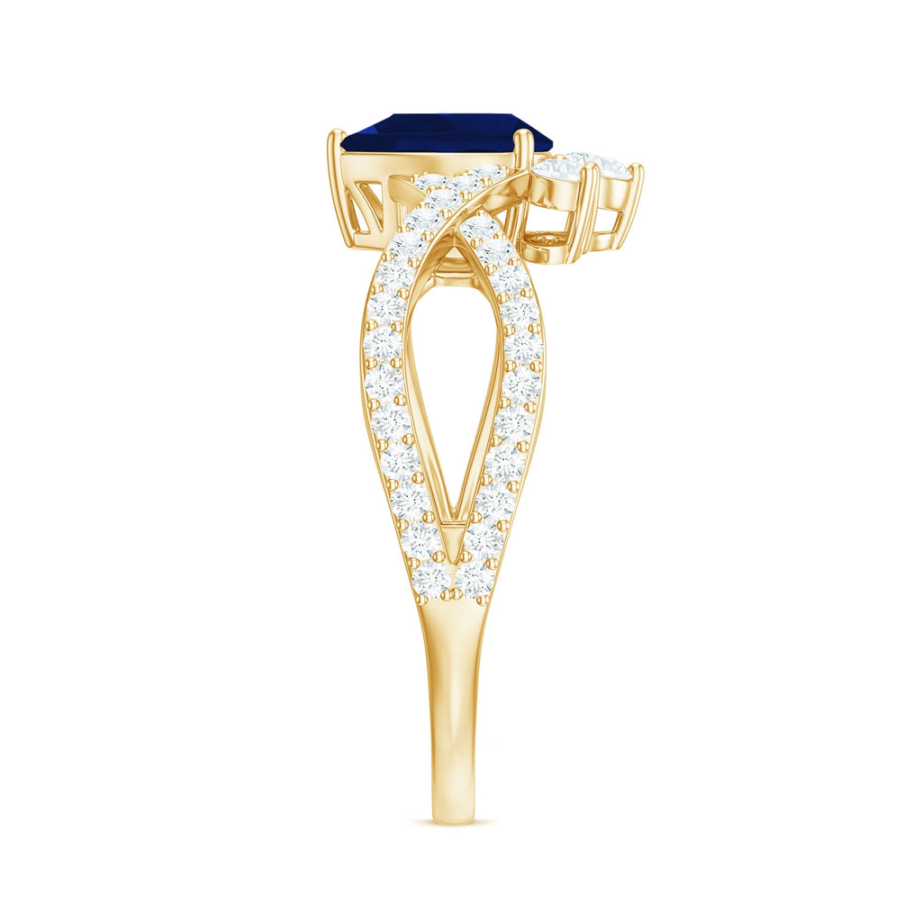 Pear Cut Blue Sapphire and Diamond Crossover Engagement Ring
