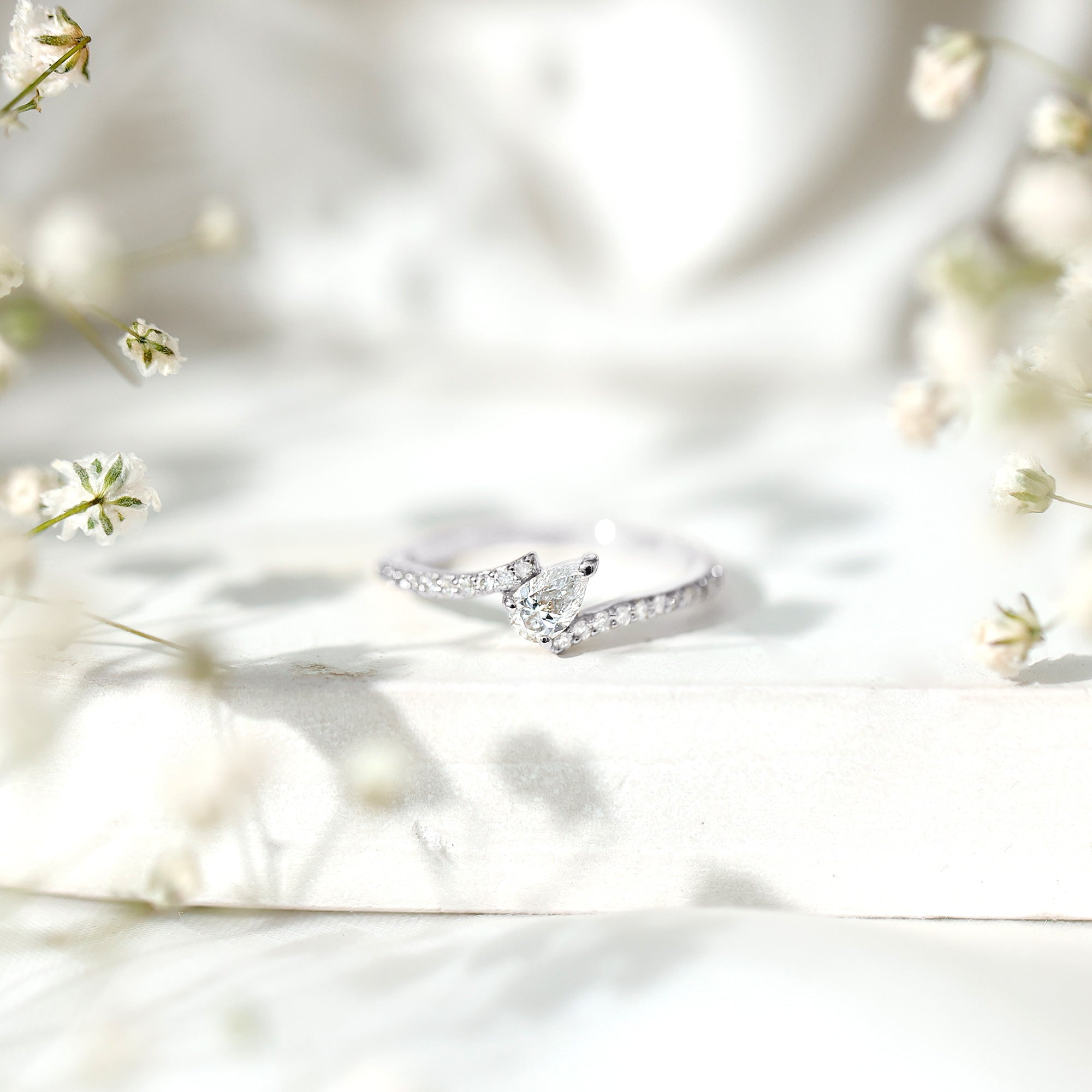 Tilted Pear Shape Simulated Diamond Bypass Promise Ring in Gold