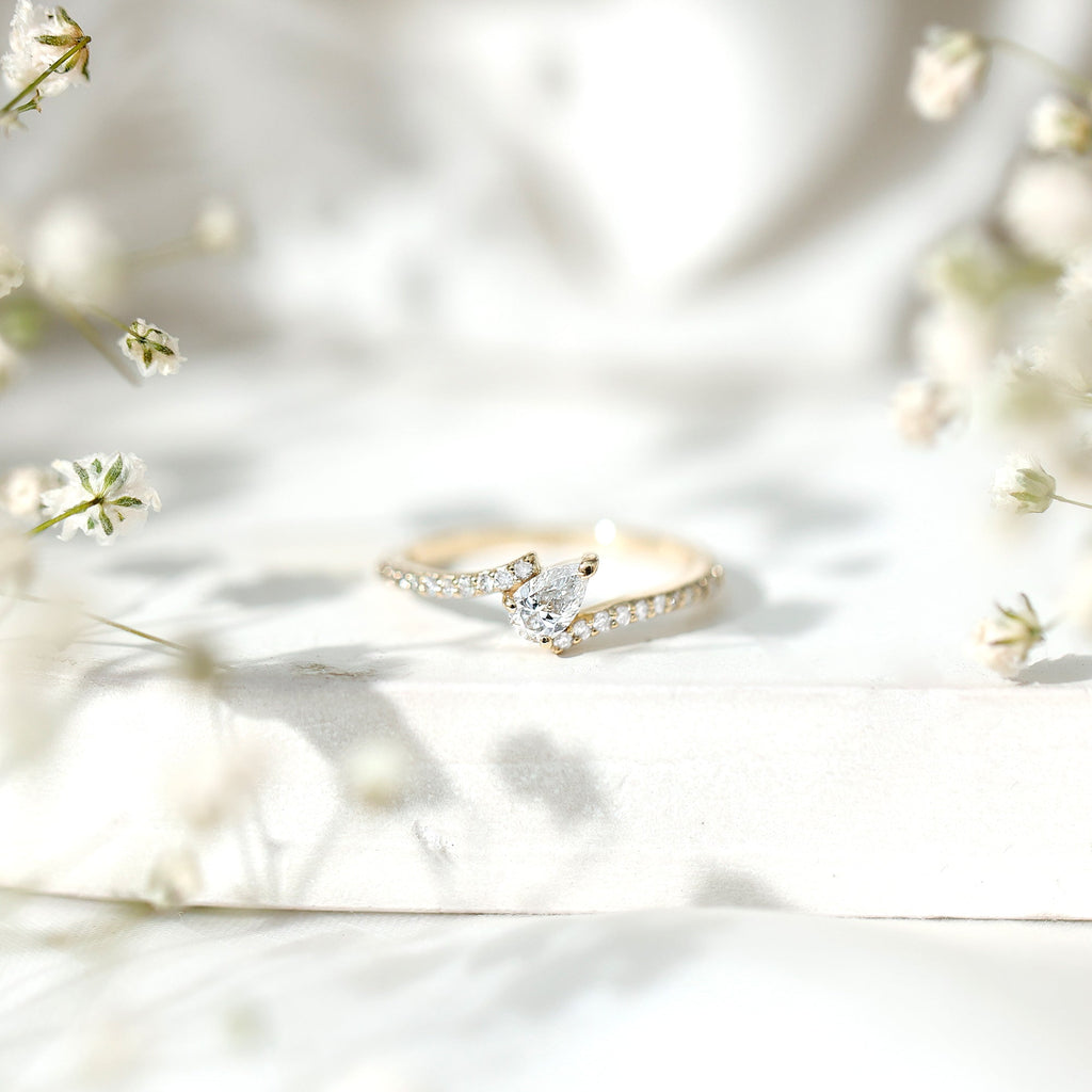 Tilted Pear Shape Simulated Diamond Bypass Promise Ring in Gold