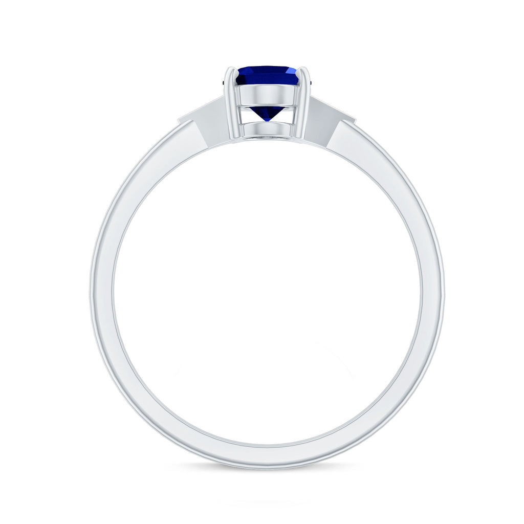 Oval Created Blue Sapphire Solitaire Ring with Diamond Accent