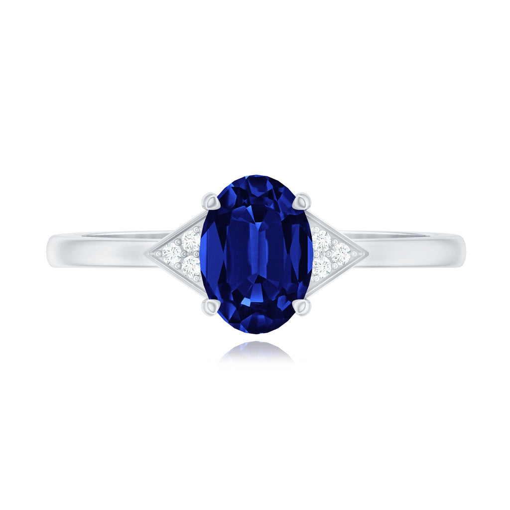 Oval Created Blue Sapphire Solitaire Ring with Diamond Accent