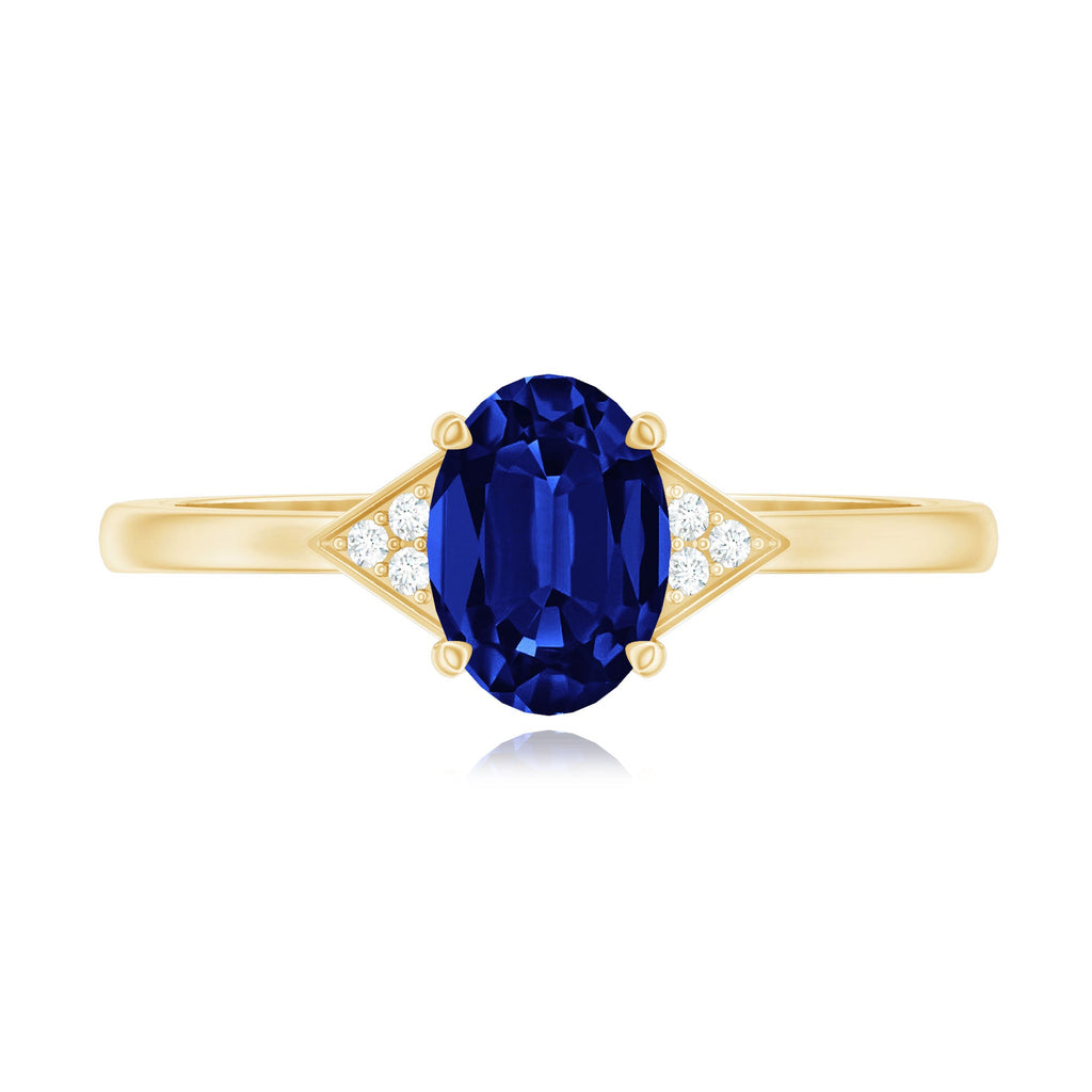 Oval Created Blue Sapphire Solitaire Ring with Diamond Accent