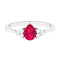 Claw Set Ruby Pear Solitaire Ring with Diamond Trio