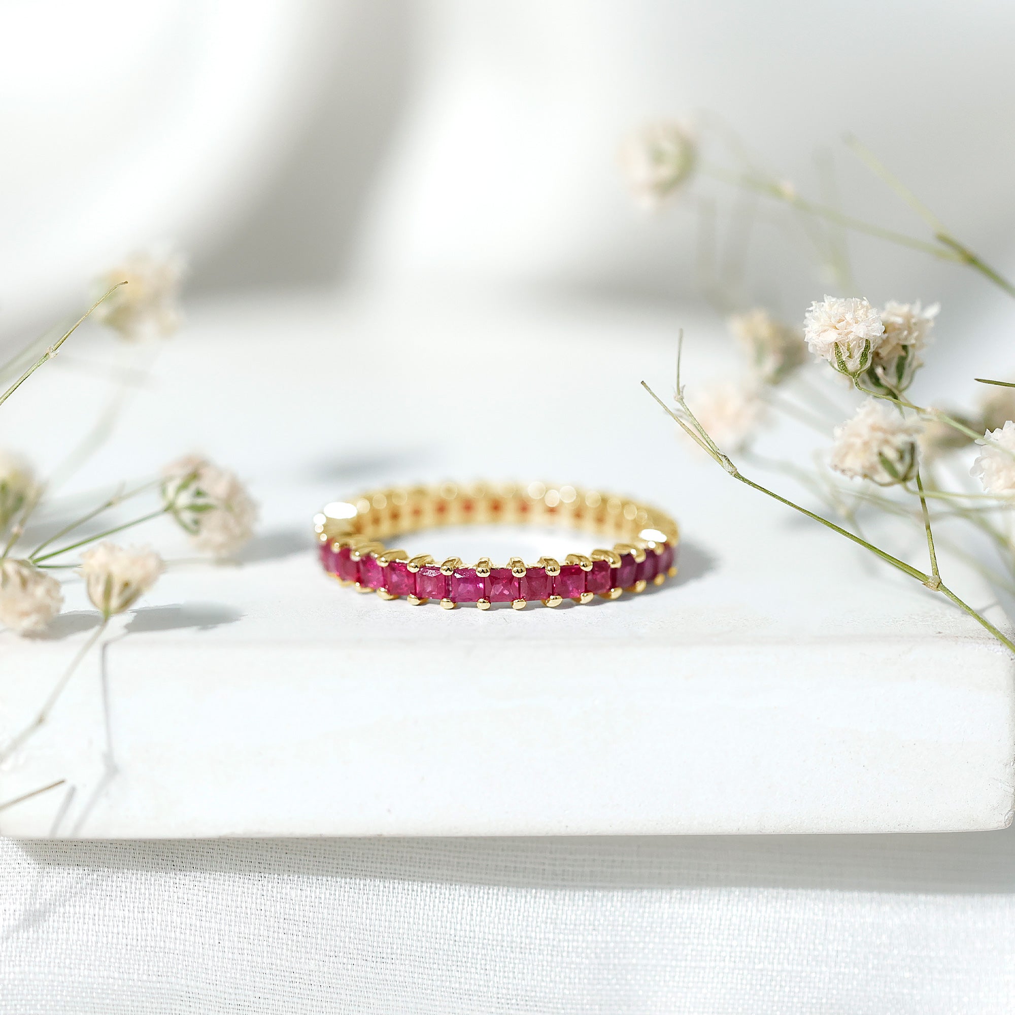 Princess Cut Ruby Eternity Ring in Shared Prong Setting