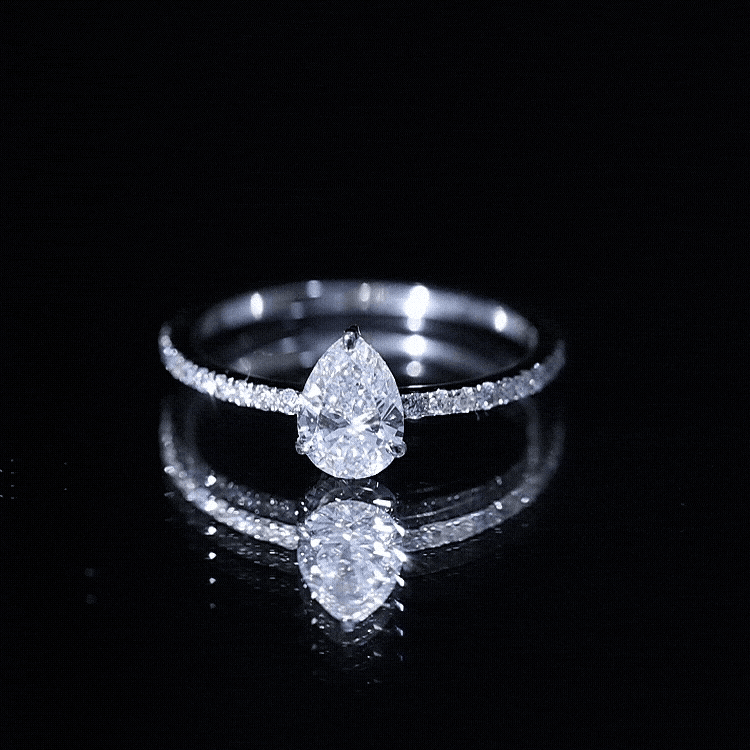 Pear Cut Moissanite Solitaire Ring with Side Stones