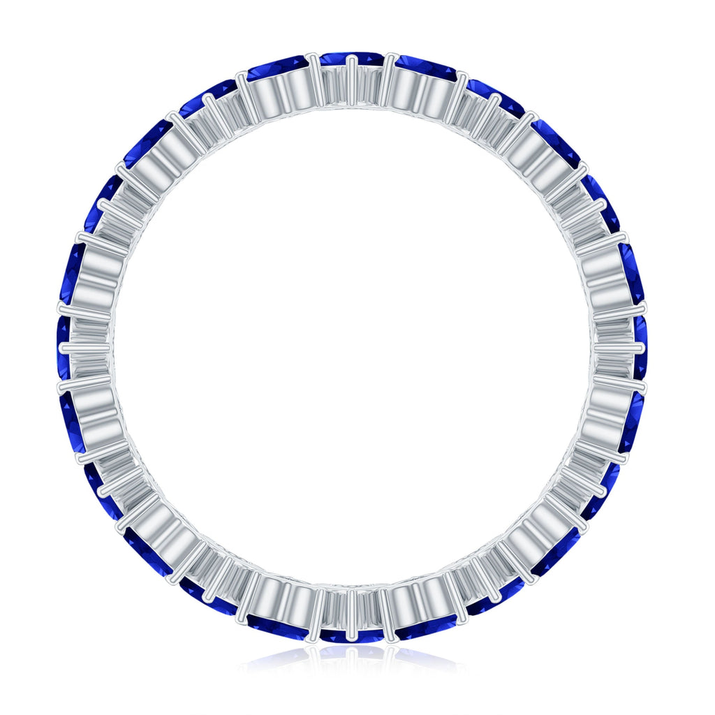 Claw Set Created Blue Sapphire Heart Eternity Band Ring in Gold