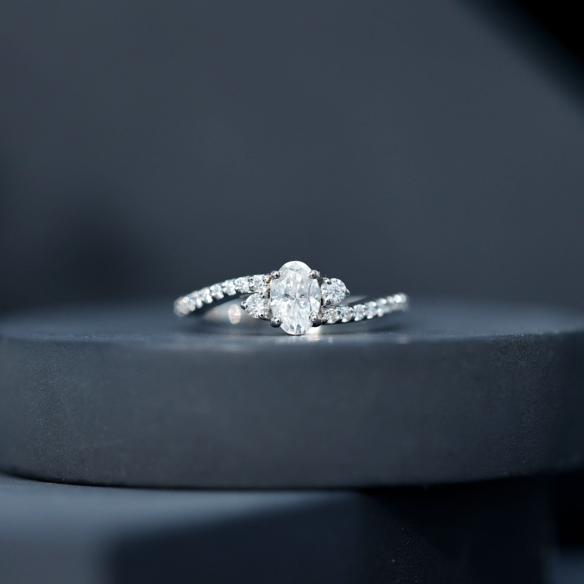 Oval Shape Moissanite Bypass Engagement Ring with Side Stones