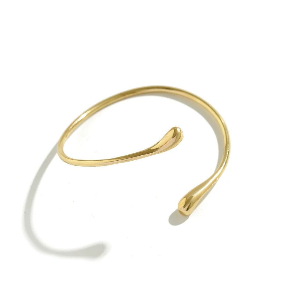 Handcrafted Gold-plated Geometric Cuff Bracelets And Boho-chic Metal Tassel Arm Rings With Vintage-inspired Exaggerated Water Drop Designs, Offering Unisex Luxury Accessories In Open Bangle Styles